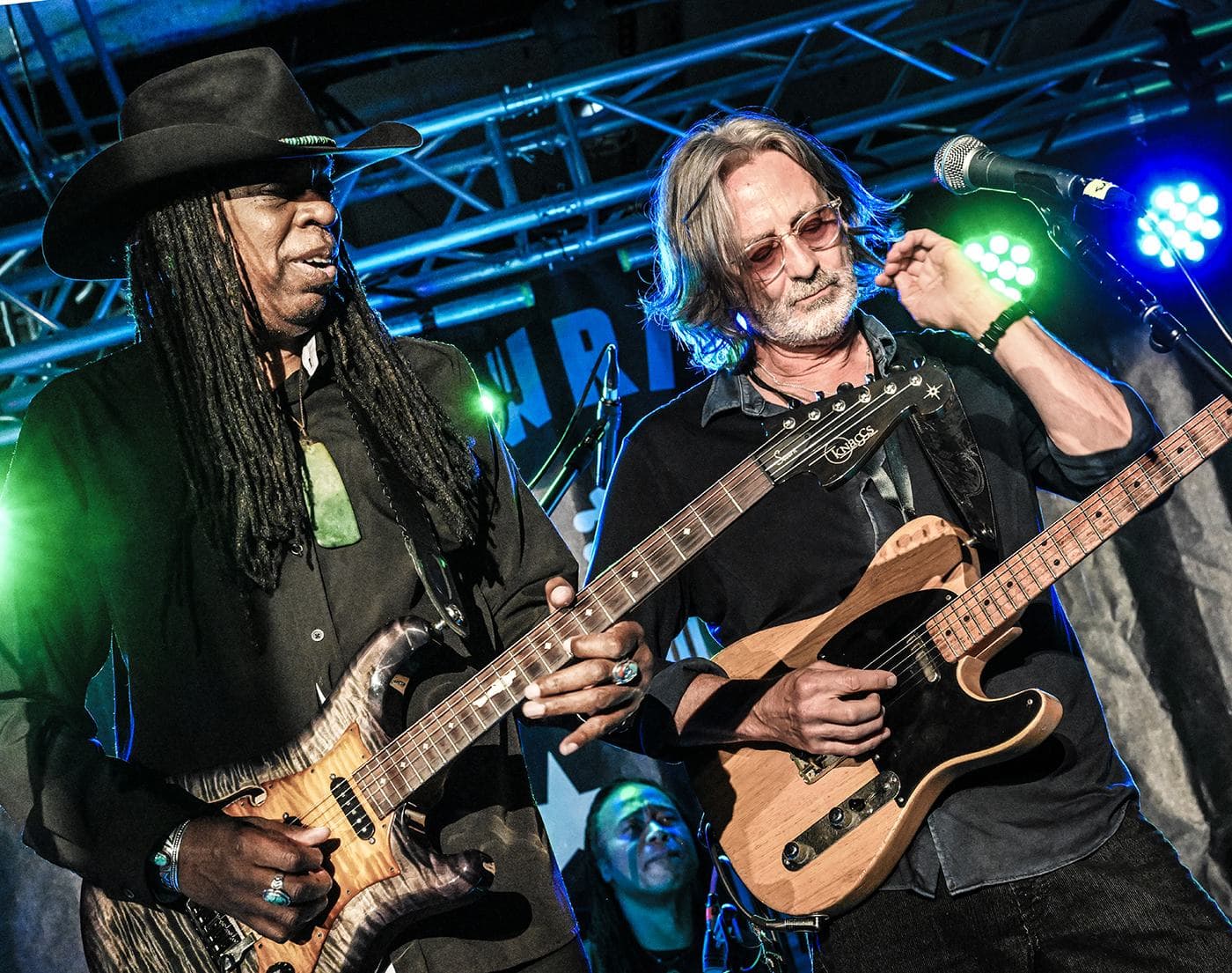 Larry Mitchell and Allen Hinds trading guitar parts at the Late Night Jam